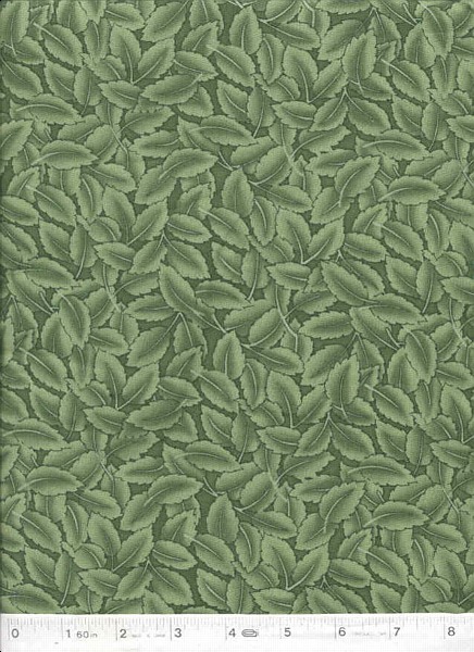 A fabric covered in mutted green tone leaves.