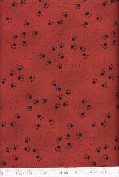 Paw prints on a dark red background.