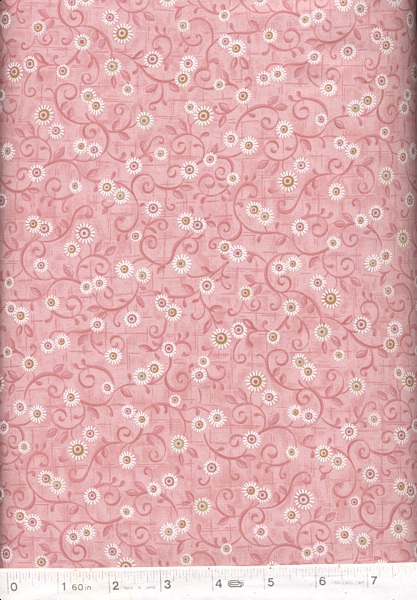 Delightful light pink fabric with tiny white flowers.