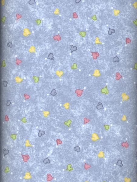 Pastel primary hearts on a country blue background on a very soft cotton flannel.